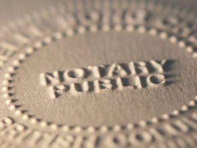 Notary public stamping a living will and healthcare directive document, ensuring legal notarization of the medical decision plan.